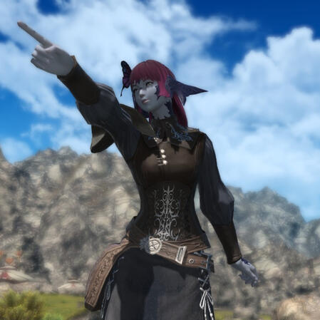 A screenshot from Final Fantasy XIV (14) featuring Maral Borlaaq. It is from the waist up. She is pointing off screen with a smile on her face. She is wearing light armour, with a brown shirt and de-saturated blue sleeves.