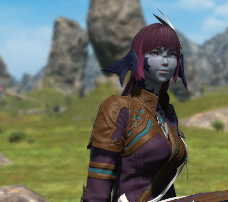 A screenshot from Final Fantasy XIV (14) featuring the player character Maral Borlaaq. Maral is sitting on the plains of the Azim Steppe wearing traditional Xaela clothing. She has feathers in her hair, and is looking off screen with a smile on her face.