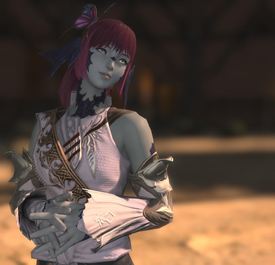 A screenshot from Final Fantasy XIV (14). It features Maral from the waist up. She is wearing a light purple stylish tank top, and a butterfly hair clip. She is lacing her fingers in front of her abdomen, and looking off screen with a tilted head.